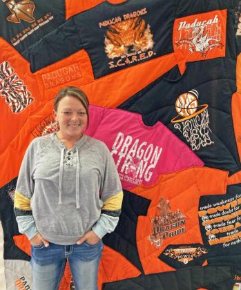 Patchwork owner Jessie Wittekiend creates a variety of colorful specialty quilts, like this one made from Dragons T-shirts. | COURTESY PHOTO