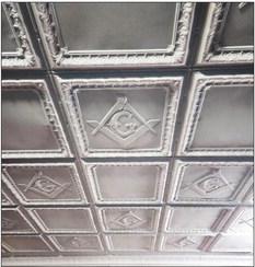 LODGEBRETHREN Metal ceiling tiles in the Lodge room bear the square and compass design.