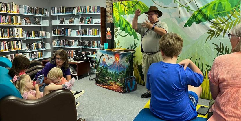 MAGICAL MYSTERY Wisconsin Johnson and the Magical Display of Mystery entertained youngsters at the Caprock Public Library in Quitaque last week, courtesy of PDA Productions from Lubbock. | COURTESY PHOTOS, GRAPHIC