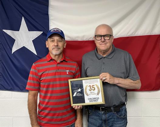 DARRELL REYNOLDS, Briscoe County maintenance, left, accepts his 35 years of service award from Childress District Engineer Darwin Lankford. | TxDOT PHOTO