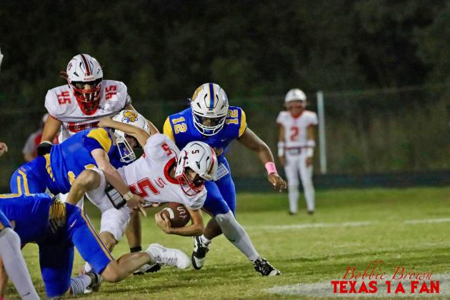 SLAYTON CAGLE POWERS THROUGH the Bulldog defensive line, looking for a first-down in the matchup against Spur on Friday, Oct. 10. | COURTESY PHOTO BY TEXAS 1A FAN