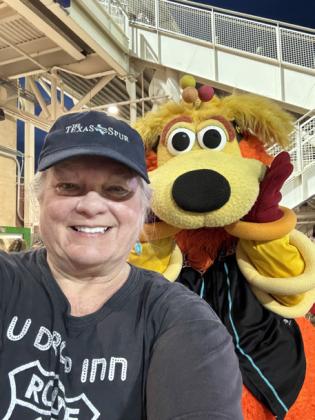 ORBIT (at right, not the figure in the Texas Spur cap) is the wacky mascot of the Albuquerque Isotopes baseball team, the only franchise in professional sports to get its name from a“Simpsons” TV episode. | THE TEXAS SPUR