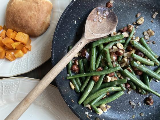 FRESHANDFANCY Fresh green beans seasoned with a garlic are wonderful for our typical dinners, but for the holidays, fresh greens beans accented with shallots and toasted hazelnuts take plain green beans from average to fancy. | ANGELINA LaRUE PHOTO