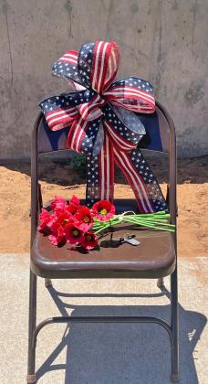 THEEMPTYCHAIR symbolized the life unfinished, the conversations never had, the dinners never shared, the futures cut short and reflecting the personal cost of war on families and communities. | DEIDRA CLIFTON PHOTO
