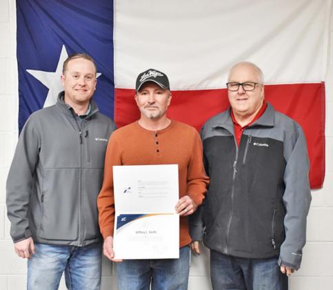 QUARTER OF A CENTURY Briscoe County maintenance supervisor Jeff Smith, center, was presented with an award for his 25 years of service to the Childress District of the Texas Department of Transportation on Wednesday, Jan. 5 in Childress. Childress area engineer Matt Herbstritt, P.E., and Childress district engineer Darwin Lankford, P.E., are also pictured.