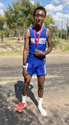 TOO FAST FOR SHOES Micah Ferrel showed his dedication at the Clarendon Lake Greenbelt Run cross country meet on Tuesday, Sept. 16, when he was forced to kick off his shoe and run in a sock rather than stopping to tie his laces, resulting in a second-place medal.
