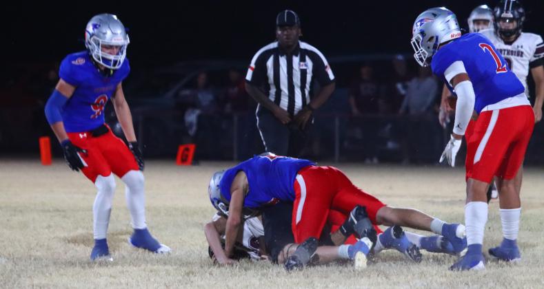 PATRIOT PANCAKE #21 Cole Walden and #10 Tripp Carlisle sack the Indian QB for a big backfield play in the Bi-District Championship game last Friday night. | VALLEY YEARBOOK