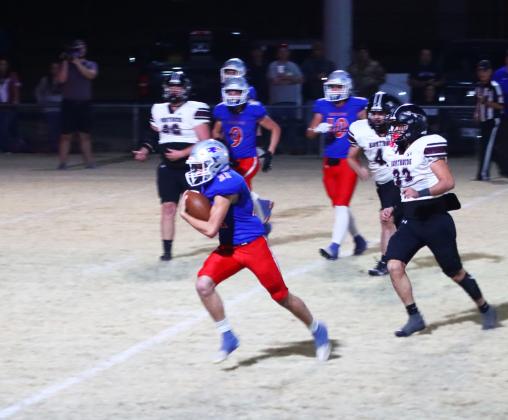 WALDENBREAKSFREE Patriot freshman ColeWalden breaks free of the Northside defensive line to run the ball for a touchdown in the Bi-District Championship game last Friday night. | VALLEY YEARBOOK