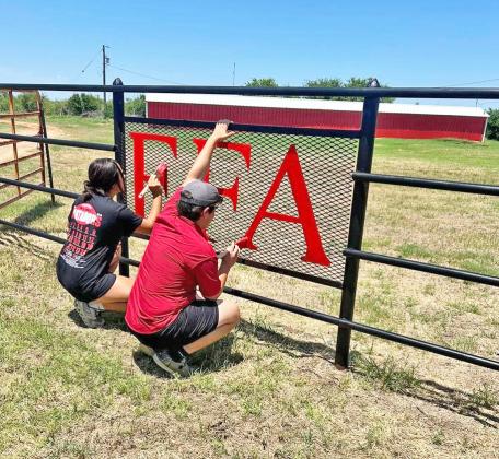 PAINT THE TOWN—AND COUNTRY Motley County FFA last week gave a much-needed facelift to the entrance gate of the ag farm, which now sports bright red letters against black pipe. | COURTESY PHOTO