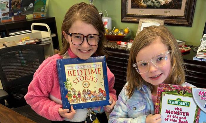 SILVERTON LIBRARY A couple of cheerful visitors spent time at the Silverton Library during the Christmas break. Normal business hours return Tuesday, Jan. 2, 10 a.m. to 4 p.m., and the preschool reading time will resume the following week, Monday, Jan. 8. | COURTESY PHOTO