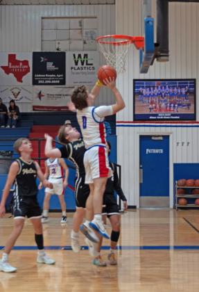 TUCKER FOR TWO Patriot Senior Carson Tucker takes the ball up for a short jumper against the McLean Tigers at home on Friday, Jan. 2. | DEY LANE