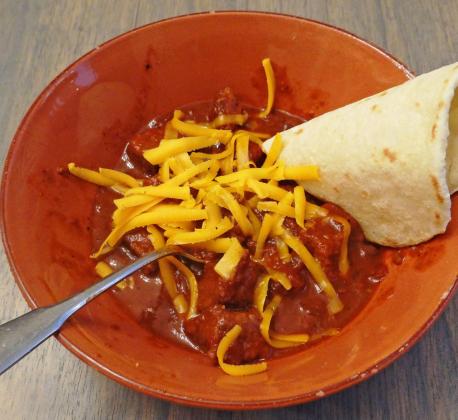 BIG, BEEFY CHUNKS OF BRISKET will satisfy the hungriest folks, in this make-ahead chili that slowly cooks in the crockpot while you’re busy watching the big game, or movies with your family. | ANGELINA LaRUE PHOTO