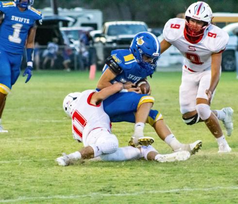 LUCASHOLT finds a Swift to make a tackle in the open field during Friday night’s game. | KODIE FAIRCHILD