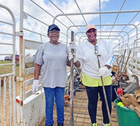 Glouris Long and Ann Hicks helped the Marshalls load a trailer Thursday afternoon.