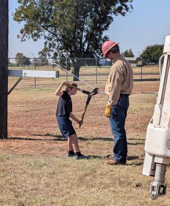 ARE YOU STRONG ENOUGH? The Motley County fourth grade class tested their strength to see if they could crimp an electrical line during their Safety Day field trip. | COURTESY PHOTO