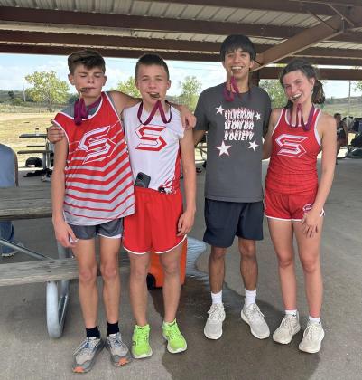 GREENBELT MEDALISTS Four Silverton Owls (from left), Corbin Hall, Briggs Holt, Haygen Lopez and Melody Rampley, placed in the top ten, earning medals at the Clarendon Lake Greenbelt Run cross country meet on Tuesday, Sept. 16. | COURTESY PHOTO