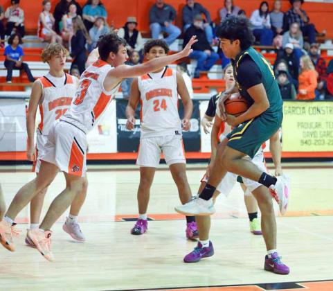 JAGSVS. DRAGONS The Lady Jags notched their second district win with a 66-39 victory over the Lady Dragons. In the highly anticipated boys’matchup, the Dragons held off a furious comeback by the Jaguars to take an exciting 65-61 win. | COURTESY PHOTOS