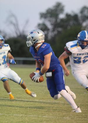PATRIOT SCRAMBLE Senior CarsonTucker scrambles to find a receiver against the Nazareth Swift defense on Thursday night, Sept. 18. | COURTESY VALLEY YEARBOOK