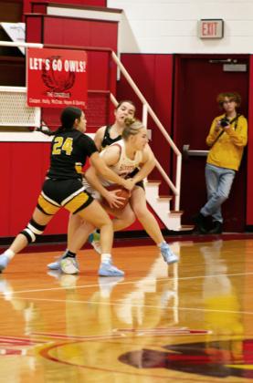 NO BEAR HUGS IN BASKETBALL unless it’s the Lady Roos versus the Lady Owls—and you are Bentlee Gamble in an aggressive ball game Friday night in Silverton.