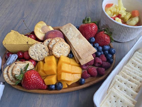 COOLANDTASTY An assortment of fruits, crackers, and cheeses, artistically arranged. makes for a great “cold plate” on summer days. | ANGELINA LaRUE PHOTO