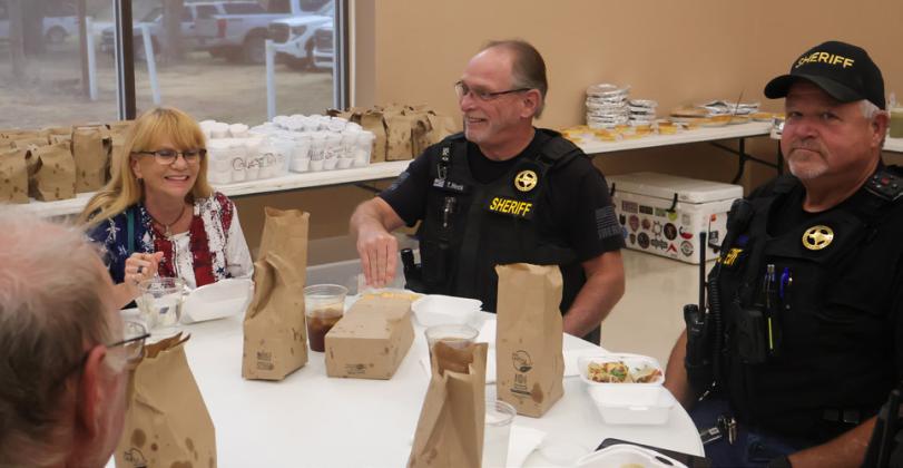 MINGLING AND MEAL Tom and Teresa Heck enjoyed dinner alongside local law enforcement at Hall County’s QTS job fair held at Valley School.
