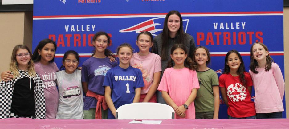 HONORED ROLE MODEL Schlueter has been an honored role model and coach to a special group of younger Lady Patriots. | COURTESY PHOTO