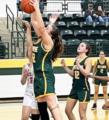 LADY JAGS Junior Lou Bonaventure grabs an offensive board for the Lady Jaguars against Rotan.