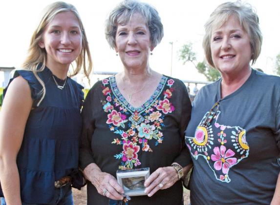 A SMITH LEGACY Honored with a special buckle award before Saturday night’s rodeo events as a longtime event supporter was Bonnie Edwards of Spur (center), herself a former rodeo queen. | THE TEXAS SPUR