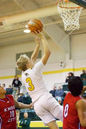 KALEBGREENUNCONTESTED Green goes up for a layup against the Knox Ci ty Greyhounds during the Roddy Shipman Classic basketball tournament in Guthrie last weekend. | SHERI BATY