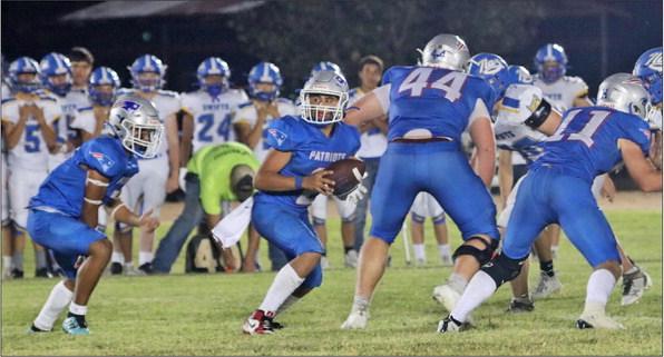 WALL OF BLOCKERS Seniors Tucker Schlueter, #44, and Cash Sperry, #11, set up the run with blocking. | COURTESY PHOTO