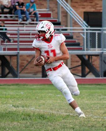 WIDEOPENSPACES Lucas Holt looks downfield, finding a route to the end zone on Thursday night, Sept. 18. | COURTESY PHOTO