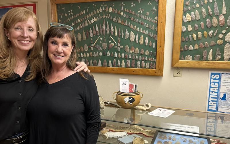 MARKER MAVENS Leesa Ruderman (left, with Rhonda Spray exploring the Jack and Rosa Spray family artifact collection at the Motley County Museum) encourages donations to offset the cost of a historical marker for the Whiteflat Cemetery. Call her at (301) 639-6369 if you can help. | COURTESY PHOTO