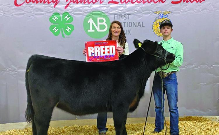 Valley'sTripp Carlisle along with his mother Shanlee show off one of his award-winning heifers at last weekend's Briscoe County Stock Show. See next week's Caprock Courier for the Winners' Circle of all area stock shows. | SHADI BUCHANAN PHOTO