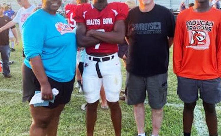 BRAZOS BOWL Paducah’s JakyenWright played in the Brazos Bowl All-Star football game Saturday and was cheered on by family. Shown are: Shantera Wright Jesse, Jakyen Wright, Darrin Jesse and Braylan Wright. | COURTESY PHOTO