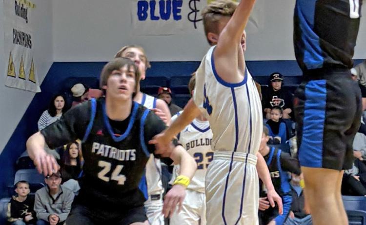 JUMPER Carson Tucker connects on a jumper against Spur while teammate Corbin Taylor blocks out. | SUE JANE SULLIVAN