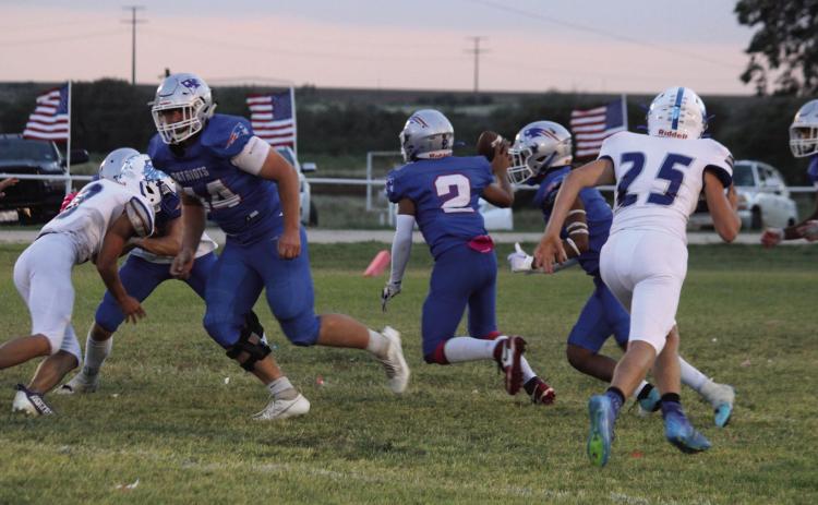 VALLEY VICTORY Freshman Damian Valdez #2 looks for a receiver while senior Tucker Schuelter #44 provides protection in Valley's 52-0 Homecoming win over White Deer. | COURTESY PHOTO