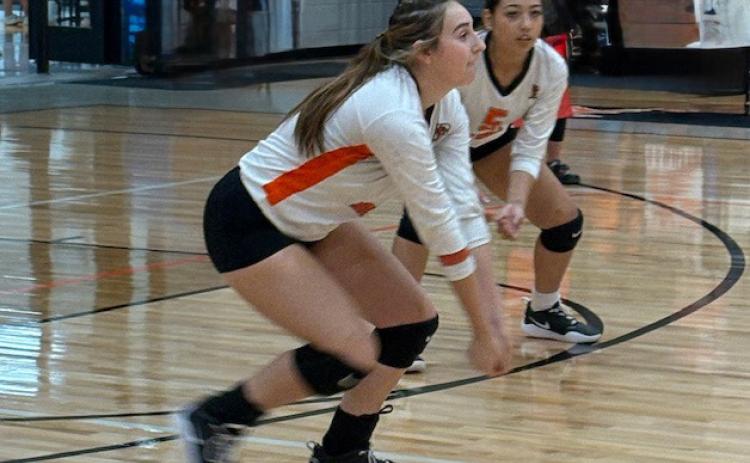 Junior Cami Canales gets a dig while teammate Ana Murguia provides cover during the Lady Dragons match against Rotan. | SUE JANE SULLIVAN