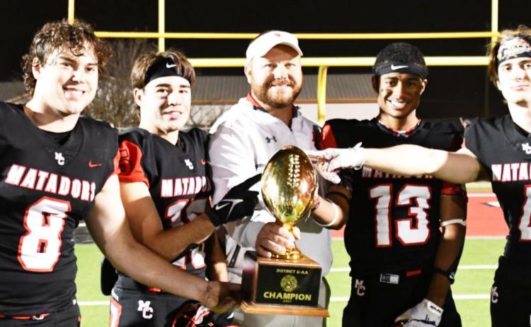 CAPTAINS &amp; COACH Motley County’s head coach Mike Bigham celebrates a playoff victory with the team captains—all seniors, from left, #8 Jace Martin, #15 Kason Degan, #13 Demetric Sims and #4 Jake Richards. | COURTESY PHOTO