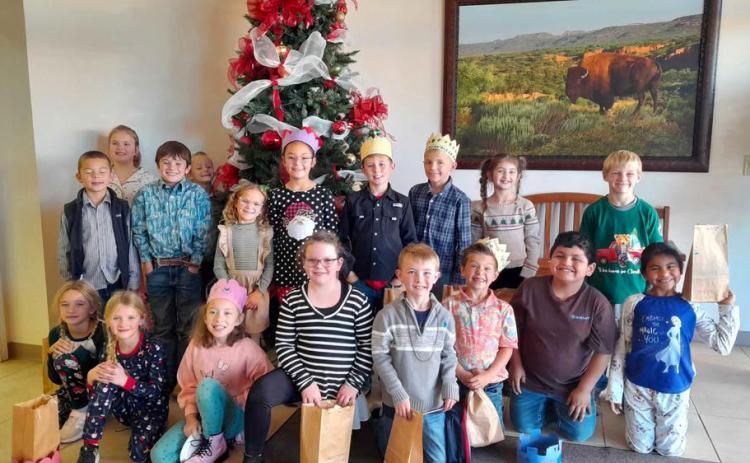 HOLIDAY ‘TRAVELS’ Valley youngsters had a chance to learn about Christmas celebrations in other countries at a Caprock Public Library event Dec. 11 that’s become an annual tradition. | COURTESY PHOTO
