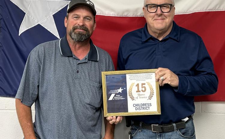 15 YEARS Cory Pointer, general transportation tech for Briscoe County, was honored with a 15-year service award. Presenting the award was District Engineer Darwin Lankford. Not pictured is Ron Gilbert, Cottle/King County maintenance supervisor, with 25 years of service. | COURTESY PHOTO