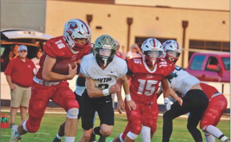 SILVERTON SHUT OUT The swarming Jayton defense shut down much of the rushing game of the Silverton Owls inThursday night’s 46-0 shut-out by the Jaybirds. Senior Sawyer Francis, #16, attempts to get some offense going. | AMANDA MCGEE PHOTO