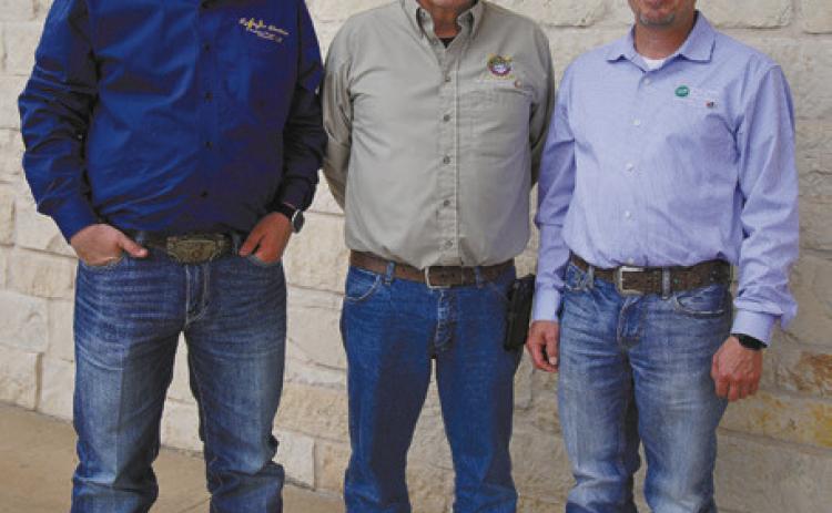 ATTHEIR BEST DannyNixon— with grandson Camden, left, and son Scott—remembers once telling a member who was stunned to see a crew out in a nasty storm, “Ma’am, when it’s the worst, that’s when we’re at our best.” | CAYTLYN CALHOUN, TEXAS ELECTRIC COOPERATIVES