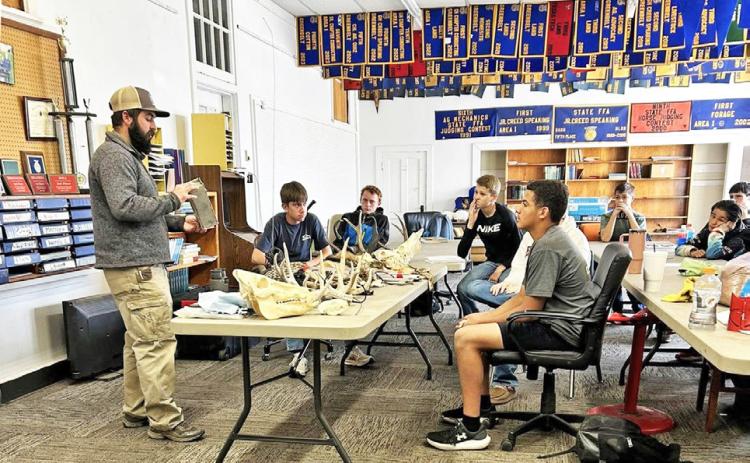 Hunter Hopkins with MatadorWildlife Management Area (Texas Parks and Wildlife) visited with the Motley County FFA Wildlife team 8th graders and discussed the different tools and techniques staff use out at the MWMA. | COURTESY PHOTO