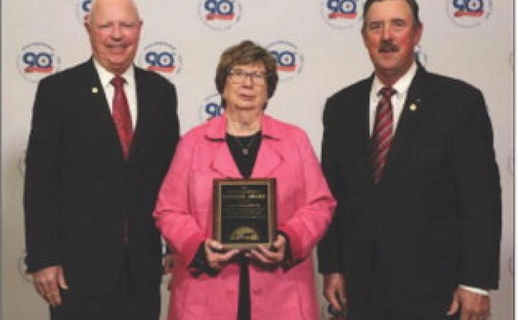 FARM BUREAU HONORS Dianne Washington (center) accepted the Texas Farm Bureau (TFB) District 2 Pioneer Award on Dec. 2 on behalf of the late Seab Washington of Motley County. The award was presented by TFB President Russell Boening (right) and TFB Secretary-Treasurer / District 2 State Director Walt Hagood. | COURTESY PHOTO