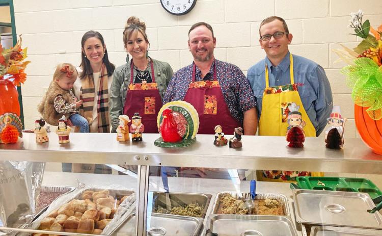 GCSD BOARD The Guthrie Common School District board of trustees helped students to get into the holidays by serving Thanksgiving lunch at school last week. | COURTESY PHOTO