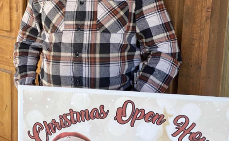 CHRISTMAS NIGHT OWL Rowdy Cogdell of Night Owl Espresso &amp; Tea joins other downtown merchants in welcoming residents and visitors to take part in Silverton’s citywide Christmas Open House Saturday, Dec. 3. MORE PHOTOS, PAGE 8 | COURTESY PHOTO