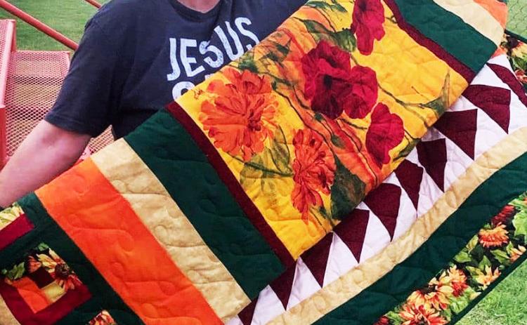 CongratulationsgotoAnnCramer-Flemingon winning the Paducah Pool Project quilt raffle at the community’s Fourth of July celebration. Ann is the daughter of former Paducah mayor Rodger Brannen. | COURTESY PHOTO
