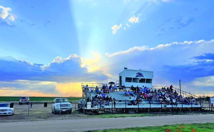 SUNSET ON SUMMER Despite the 105-degree weather, the sun is setting on summer. Last week, teachers went back to school, this week students return, and across Caprock Country football teams began scrimmaging against other opponents. Friday night the Valley Patriots were just one of the many 1A teams who traveled long, hot roads to begin the journey to another year of dreams for teams and towns. The Patriots faced the Meadow Broncos in a scrimmage. | TEXAS 1A FAN PHOTO