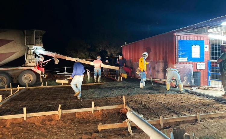 PADUCAH POOL PROGRESS Construction is coming along on the Paducah city pool.This concrete crew was pouring concrete around 4 a.m.Tuesday, July 7, and was to be done with the work by Wednesday. | COURTESY PHOTO