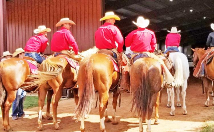 EQUINE ENTRANCE Cowboys prepare to promenade with horses for sale at a previous “Return to the Remuda” at the Four Sixes Ranch in Guthrie. | CAPROCK COURIER